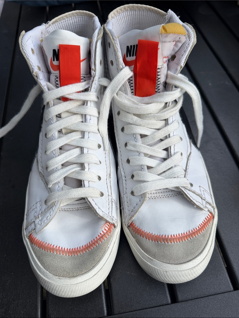 Nike White High-Top Sneakers with Orange Accents and Gray Suede Toe